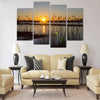 Spring sunset on the river, the sun in the reeds Multi panel canvas wall art