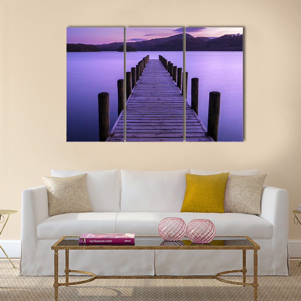 An evening view of a jetty on Coniston Water in the UK multi panel canvas wall art
