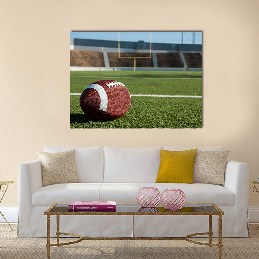 American football on field with goal post in background Multi panel canvas wall art