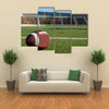 American football on field with goal post in background Multi panel canvas wall art