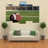 American football on field with goal post in background Multi panel canvas wall art