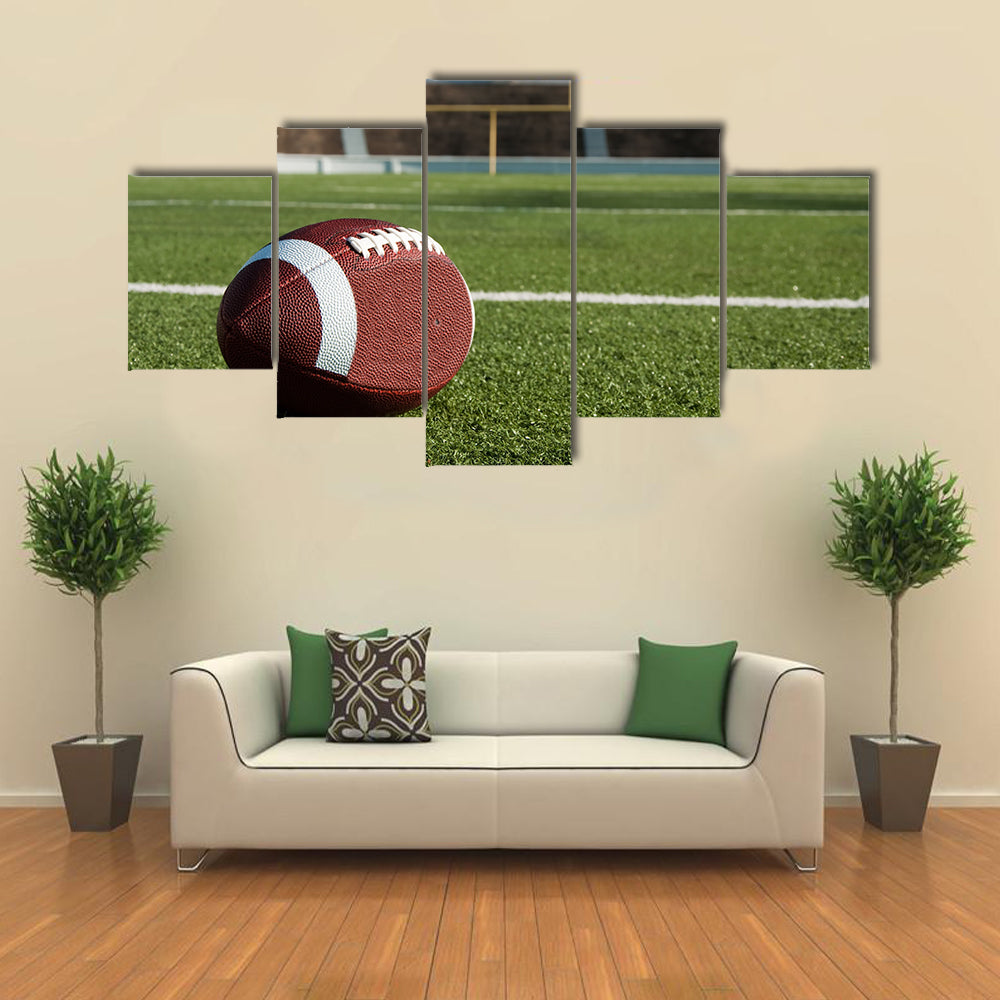 American football on field with goal post in background Multi panel canvas wall art