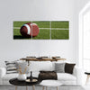 American football on field with goal post in background Panoramic Canvas Wall Art