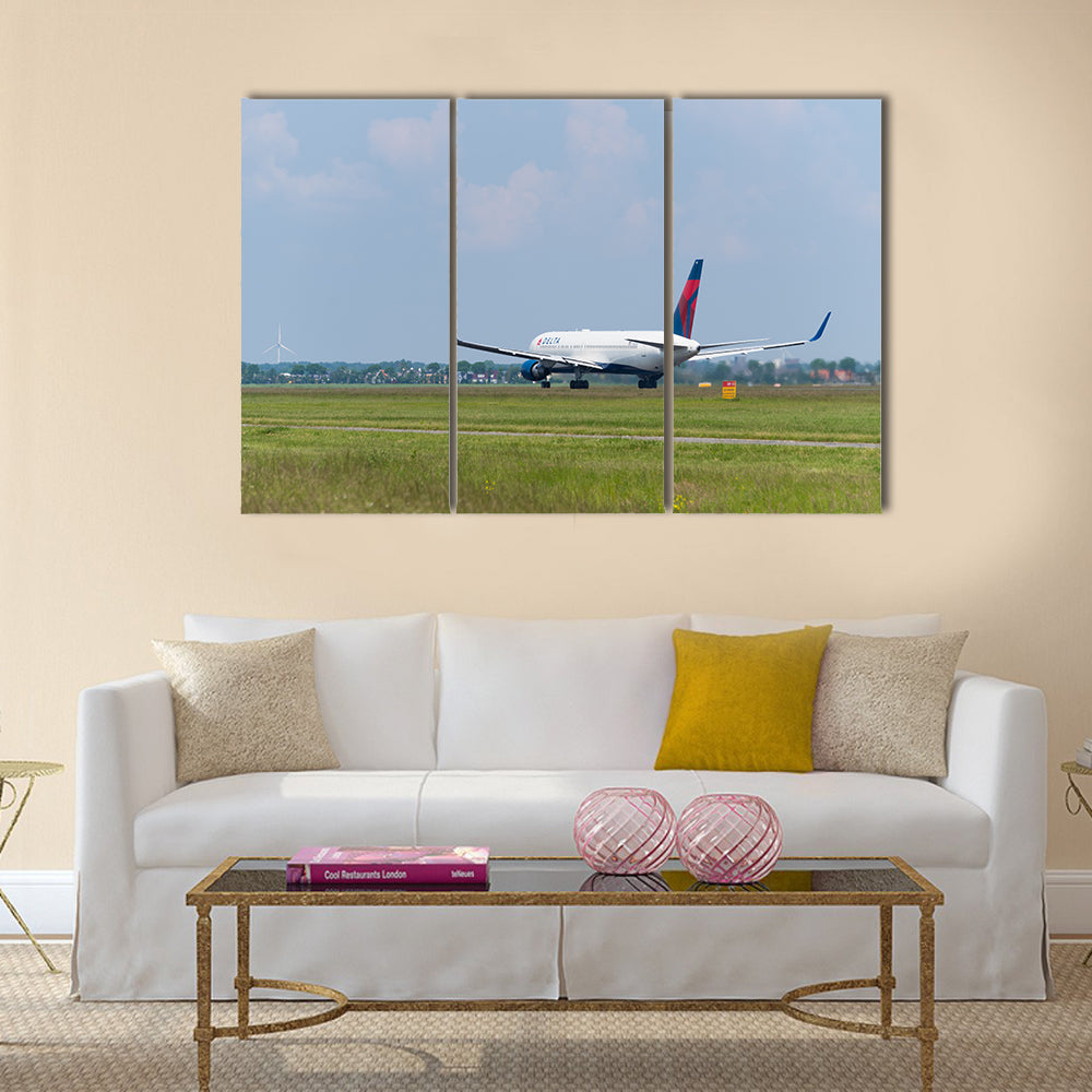 Delta airlines plane takes off at Amsterdam international airport multi panel canvas wall art