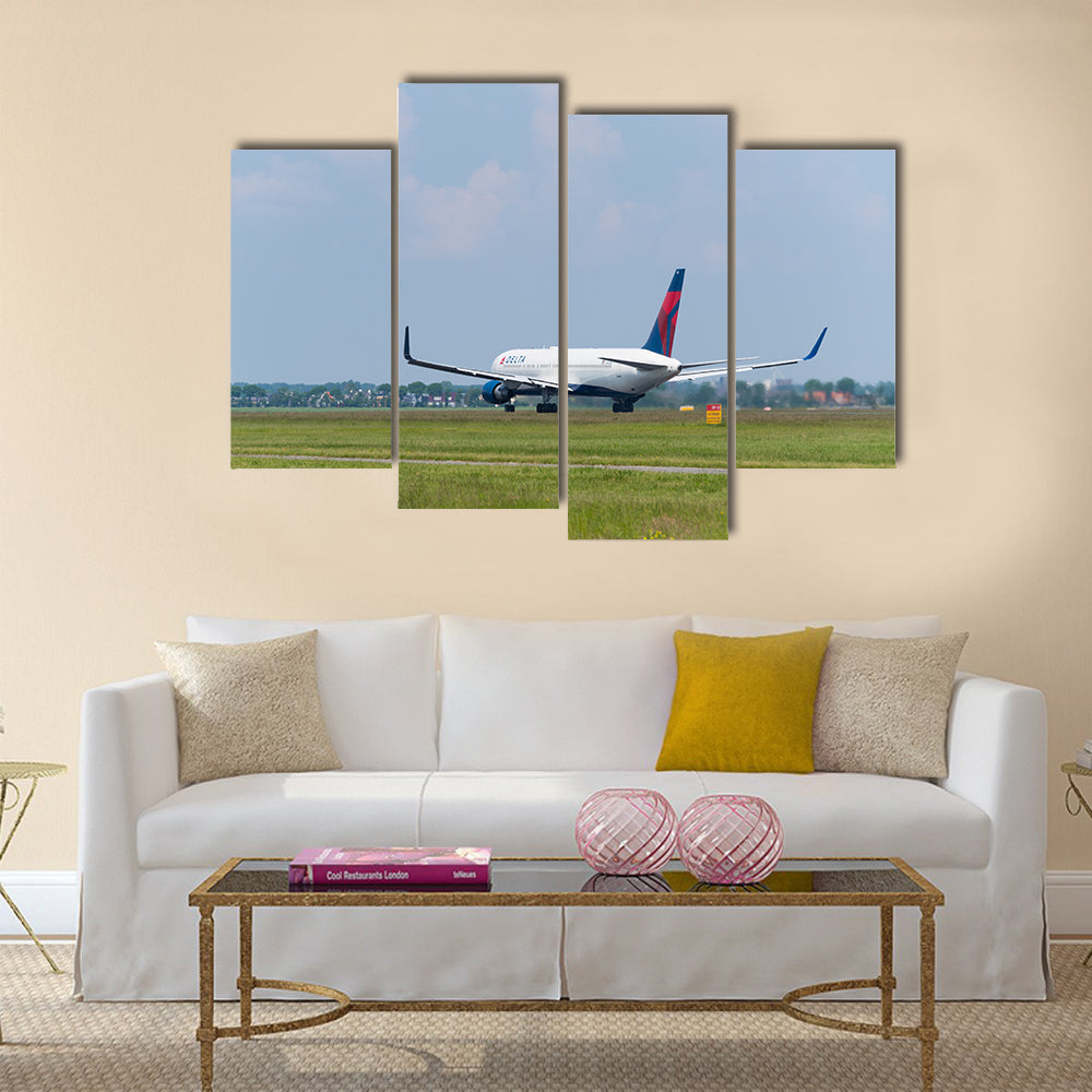 Delta airlines plane takes off at Amsterdam international airport multi panel canvas wall art