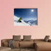 Female skier on downhill race with sun and Mountain View Multi panel canvas wall art