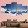 Female skier on downhill race with sun and Mountain View Multi panel canvas wall art