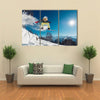 Girl is jumping with snowboard from the hill Multi panel canvas wall art