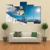 Girl is jumping with snowboard from the hill Multi panel canvas wall art