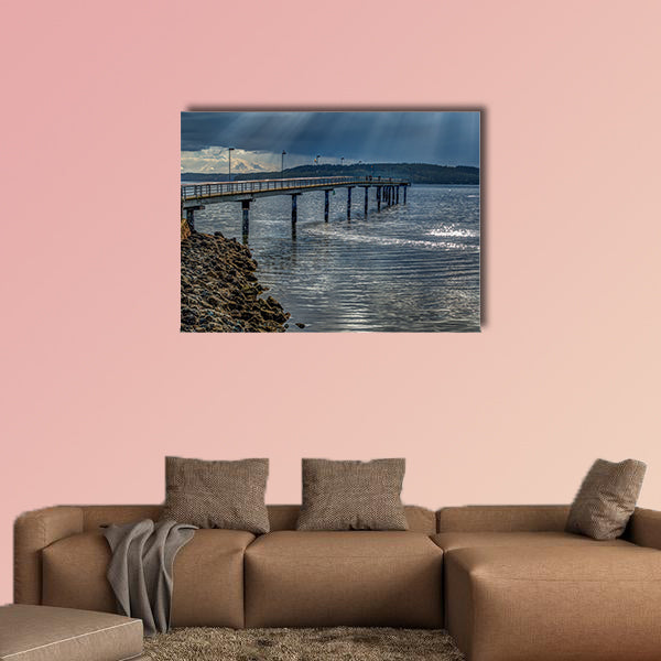 Rays of light shine through clouds in Des Moines, Washington. wall art