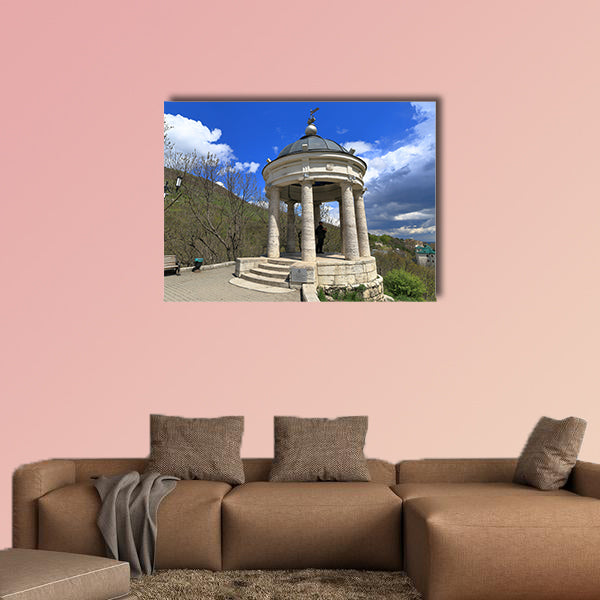 The tourist looks at the neighborhood while in the gazebo "Eolova Arfa" wall art