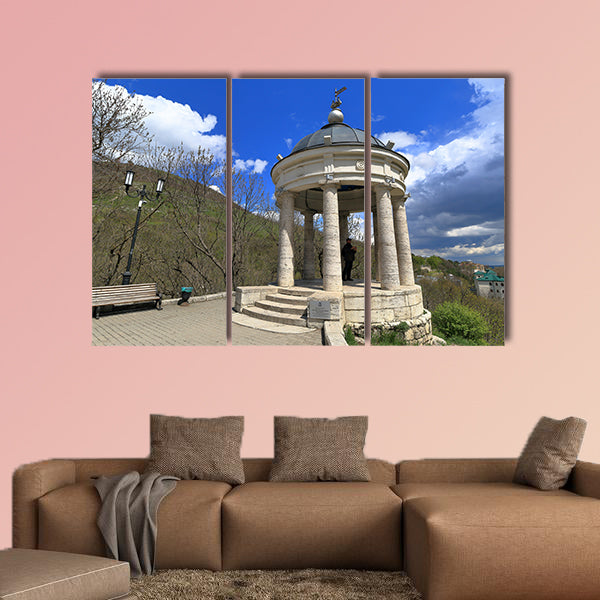 The tourist looks at the neighborhood while in the gazebo "Eolova Arfa" wall art