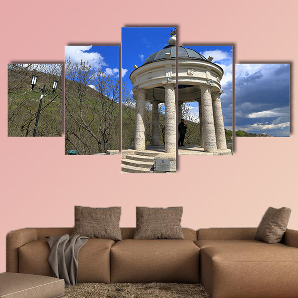 The tourist looks at the neighborhood while in the gazebo "Eolova Arfa" wall art
