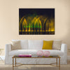 Multicolored dancing water jet fountain in the dark. multi panel canvas wall art