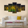 Multicolored dancing water jet fountain in the dark. multi panel canvas wall art