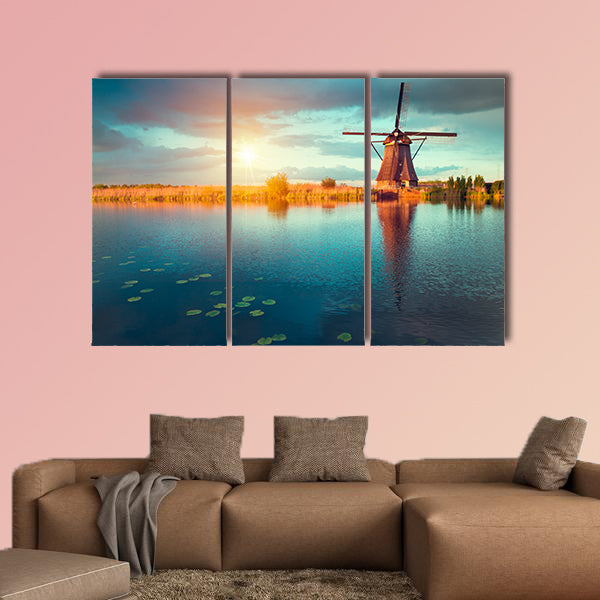 Landscape with tulips, traditional Dutch windmills and houses wall art