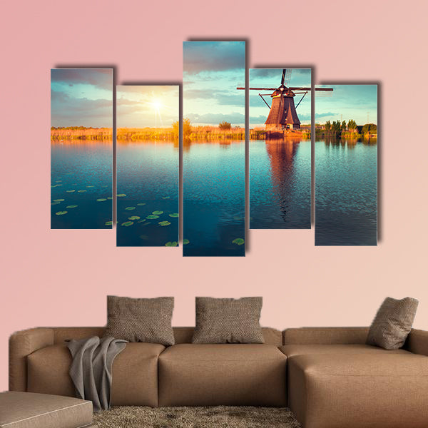 Landscape with tulips, traditional Dutch windmills and houses wall art