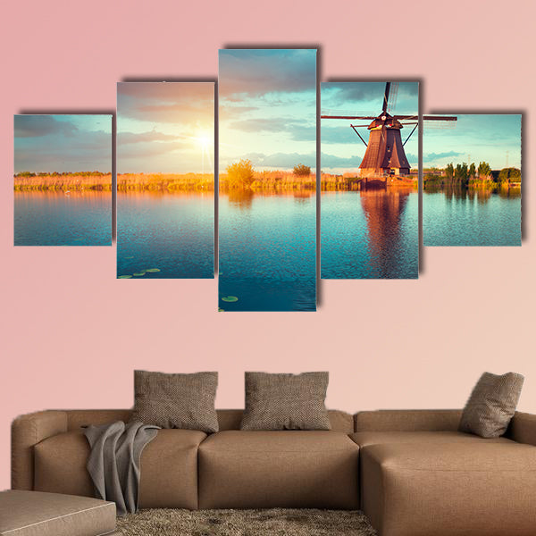 Landscape with tulips, traditional Dutch windmills and houses wall art