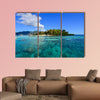 People swim in the sea at sunny day in Coron, Philippines multi panel canvas wall art