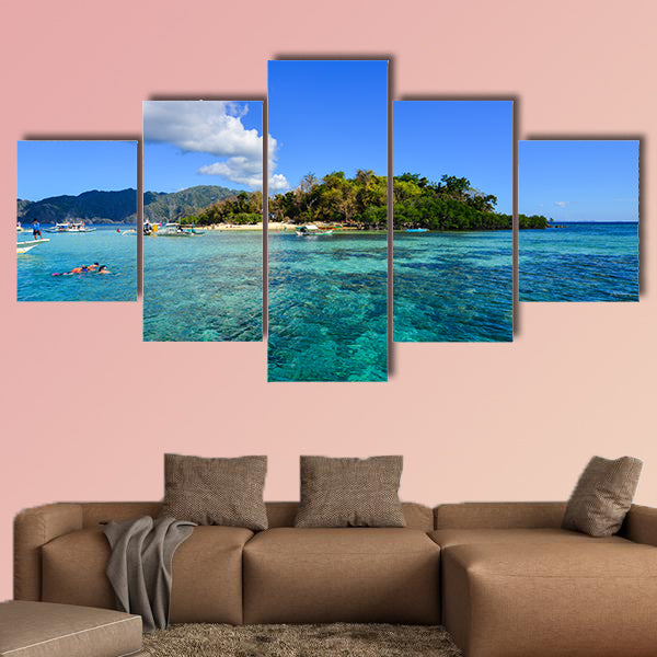 People swim in the sea at sunny day in Coron, Philippines multi panel canvas wall art