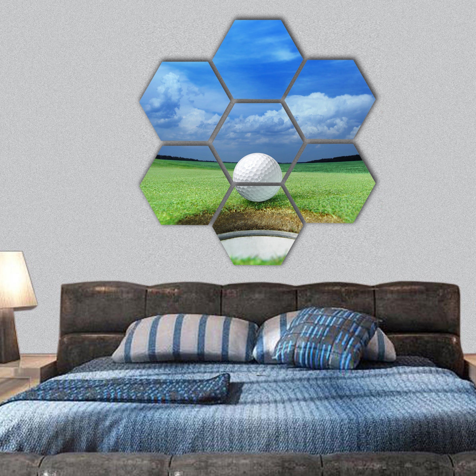 Golf ball on lip of cup of beautiful golf course hexagonal canvas wall art