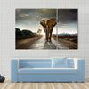 Single elephant walking in a road with the Sun from behind Multi panel canvas wall art