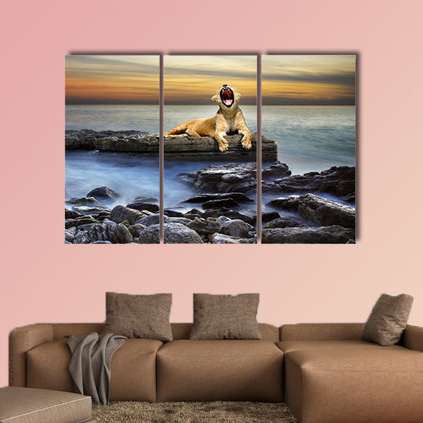 Surreal coastal scene with a lion resting on a rock multi panel canvas wall art
