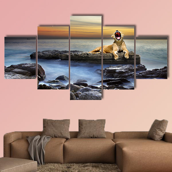 Surreal coastal scene with a lion resting on a rock multi panel canvas wall art