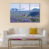 Rural village church surrounded by snow clad mountains multi panel canvas wall art