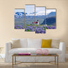 Rural village church surrounded by snow clad mountains multi panel canvas wall art