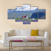 Rural village church surrounded by snow clad mountains multi panel canvas wall art