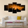 Military silhouettes fighting scene on war fog sky background Multi Panel Canvas Wall Art