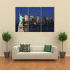 The landmark Statue of Liberty against the impressive New York City skyline Multi panel canvas Wall art