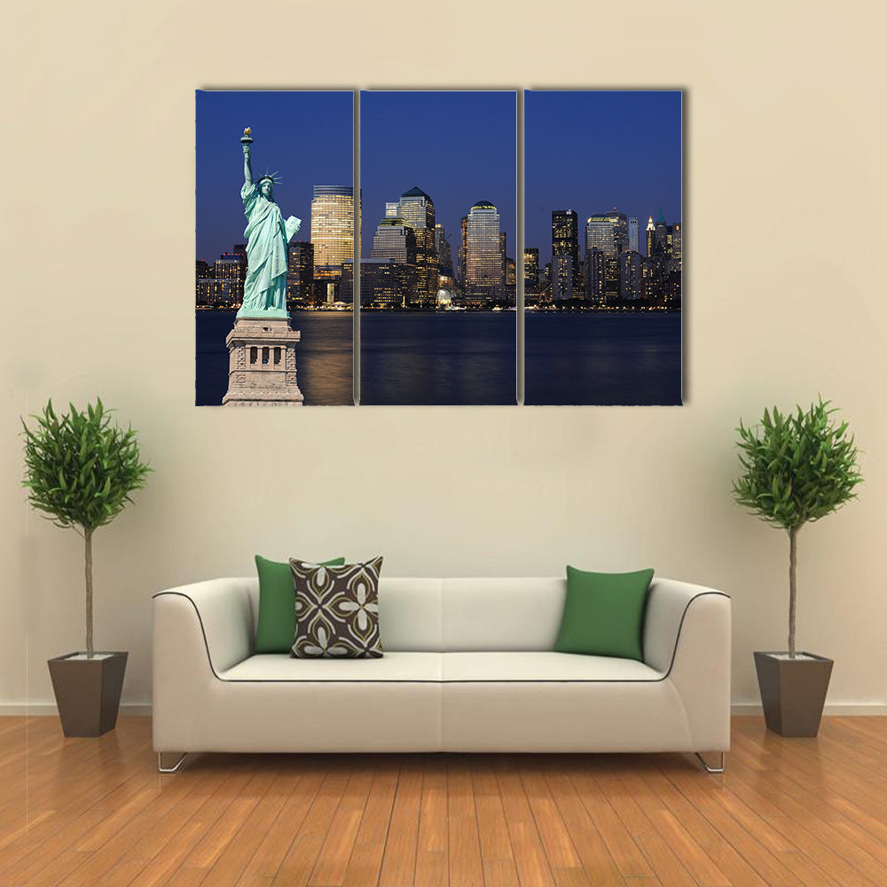 The landmark Statue of Liberty against the impressive New York City skyline Multi panel canvas Wall art