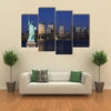 The landmark Statue of Liberty against the impressive New York City skyline Multi panel canvas Wall art