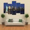 The landmark Statue of Liberty against the impressive New York City skyline Multi panel canvas Wall art