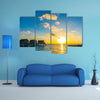 A Couple Enjoys An Idyllic Sunset Stroll Along The Silhouetted Boardwalk Multi Panel Canvas Wall Art