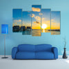 A Couple Enjoys An Idyllic Sunset Stroll Along The Silhouetted Boardwalk Multi Panel Canvas Wall Art