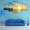 A Couple Enjoys An Idyllic Sunset Stroll Along The Silhouetted Boardwalk Multi Panel Canvas Wall Art