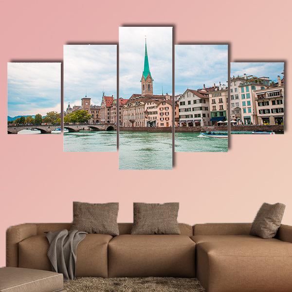 View of the historic city center of Zurich with famous Fraumunster wall art
