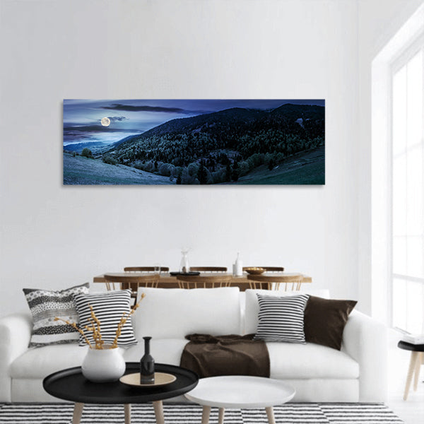 Mountain landscape hillside with trees at night in moon light panoramic canvas wall art