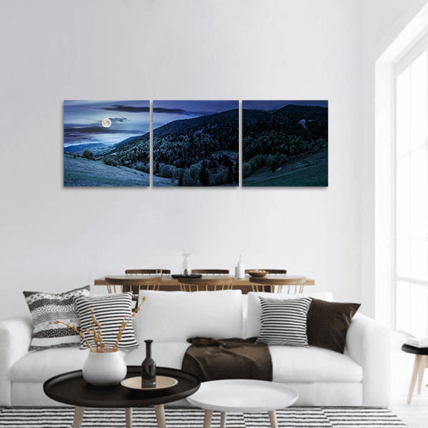 Mountain landscape hillside with trees at night in moon light panoramic canvas wall art