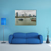 Fishing boats in a port with skyline of the Panama City multi panel canvas wall art