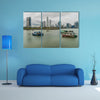 Fishing boats in a port with skyline of the Panama City multi panel canvas wall art