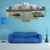 Fishing boats in a port with skyline of the Panama City multi panel canvas wall art