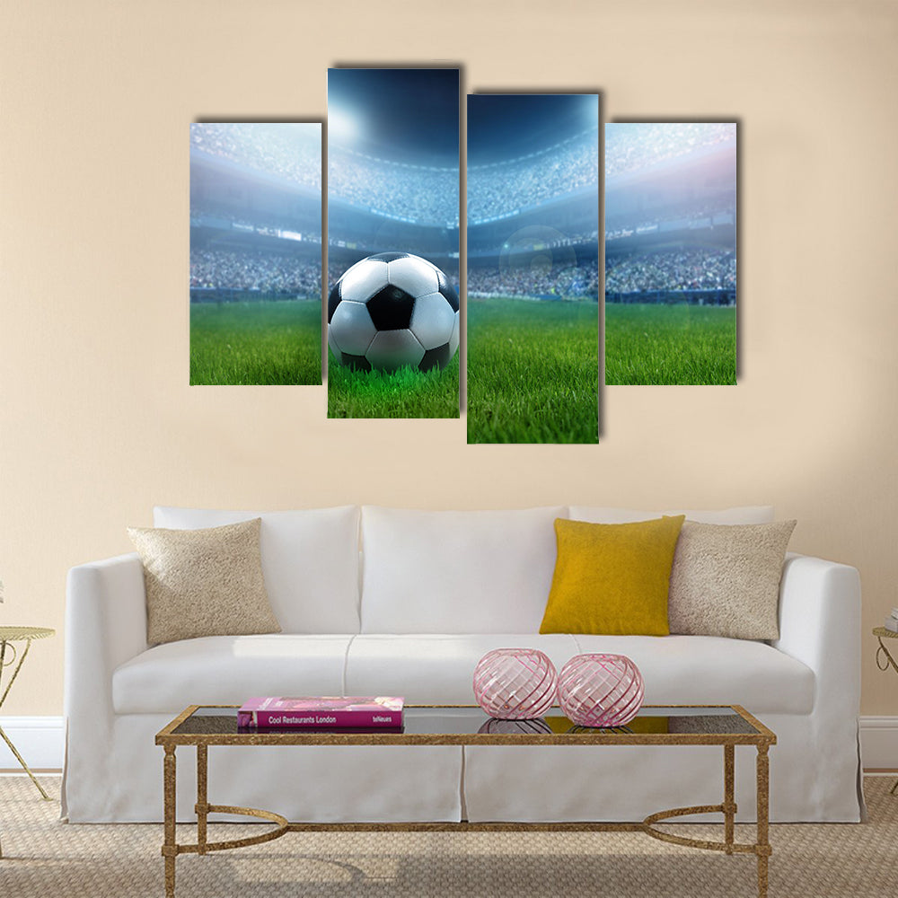 close up of a football ball on a full stadium Multi panel canvas wall art