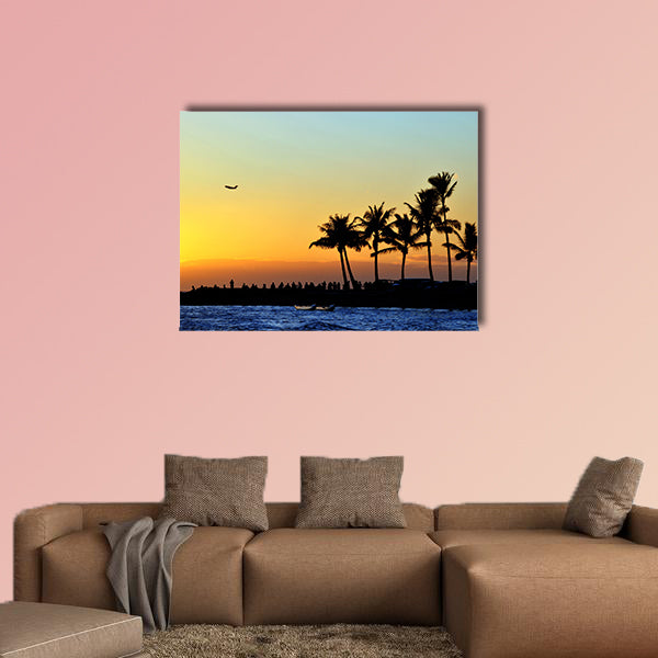 People watch the sunset on the beach Multi panel canvas wall art