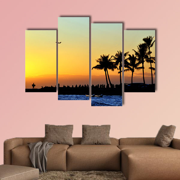 People watch the sunset on the beach Multi panel canvas wall art