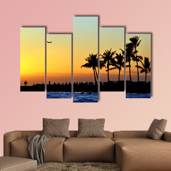 People watch the sunset on the beach Multi panel canvas wall art