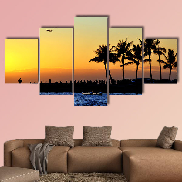 People watch the sunset on the beach Multi panel canvas wall art